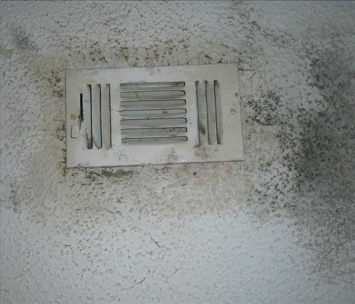 white popcorn ceiling and HVAC vent 